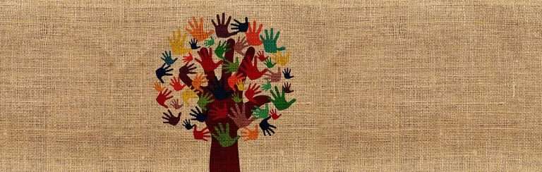 An open and raised hand forms the trunk and branches of a tree, with smaller open hands overlaid on the larger fingers to form the leaves of the 'tree'. This is on a burlap textured background.