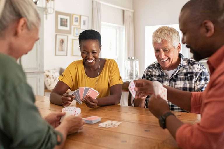 People playing cards together at home.