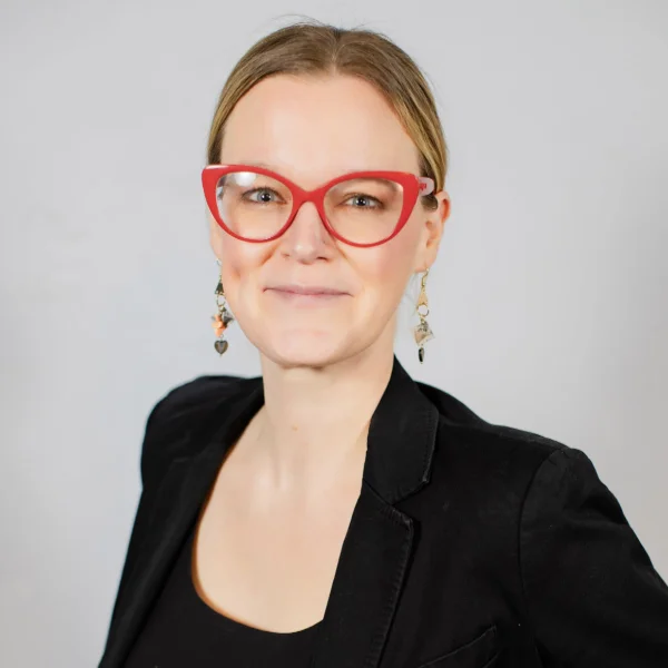 Krista Hudson smiles at the camera.